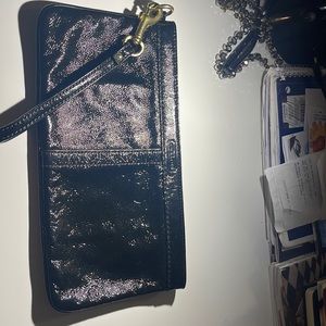 I am selling a black coach wristlet
